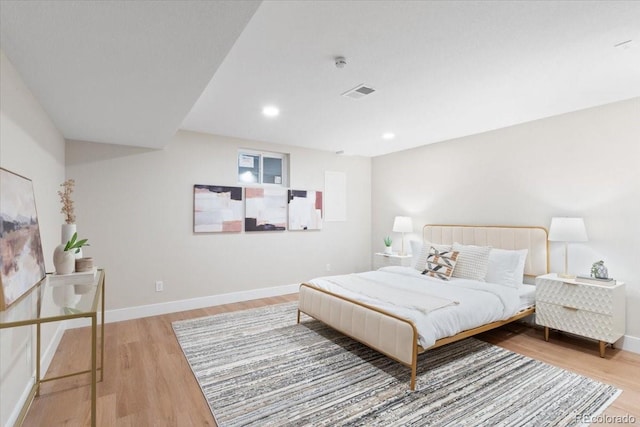 4505 S Yosemite St Unit 362, Denver, CO 80237 - bedroom featuring wood finished floors, baseboards, and recessed lighting