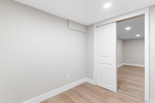 4505 S Yosemite St Unit 362, Denver, CO 80237 - unfurnished bedroom with light wood-style floors, baseboards, recessed lighting, and a closet