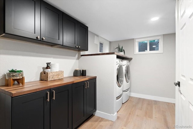 4505 S Yosemite St Unit 362, Denver, CO 80237 - laundry room with washer and dryer, light wood-type flooring, baseboards, cabinet space, and recessed lighting