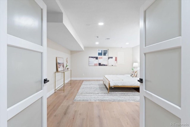 4505 S Yosemite St Unit 362, Denver, CO 80237 - bedroom featuring light wood-type flooring, recessed lighting, and baseboards