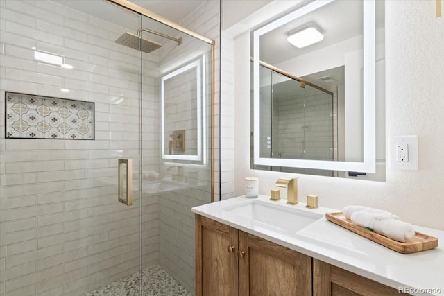 4505 S Yosemite St Unit 362, Denver, CO 80237 - bathroom featuring vanity and a stall shower