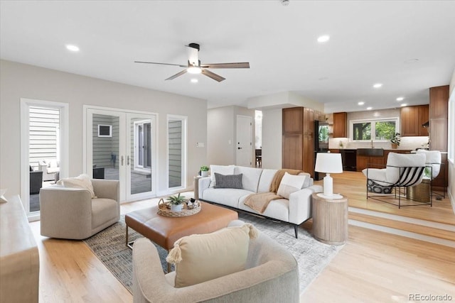 4505 S Yosemite St Unit 362, Denver, CO 80237 - living room with light wood finished floors, ceiling fan, and recessed lighting