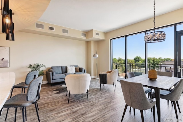 dining space featuring hardwood / wood-style flooring