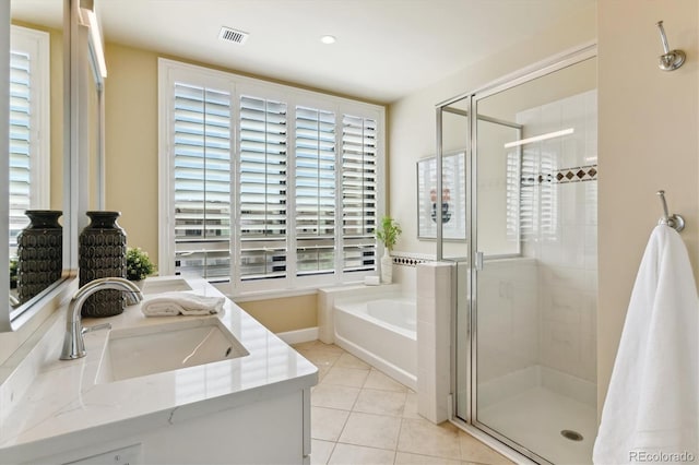 bathroom with vanity, tile patterned flooring, and independent shower and bath