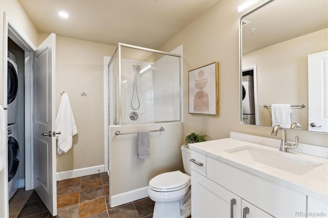 bathroom featuring stacked washer and clothes dryer, toilet, an enclosed shower, and vanity