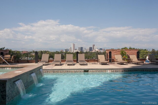 view of pool featuring a patio and pool water feature