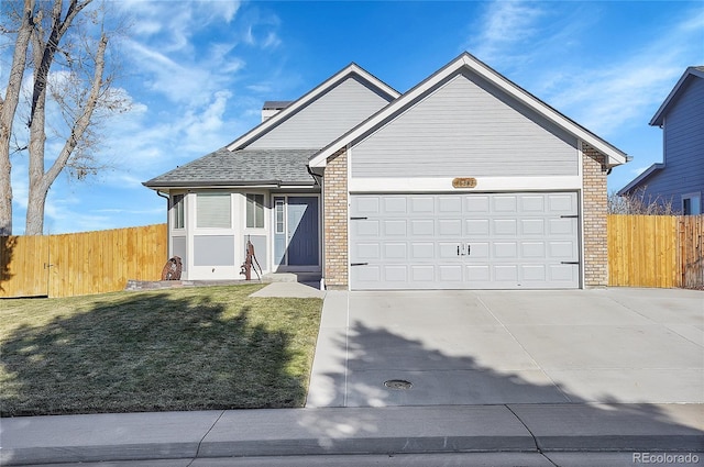 single story home featuring a garage, concrete driveway, brick siding, and fence