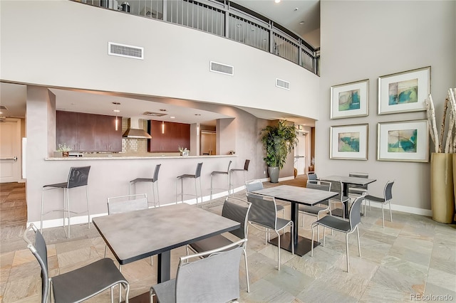 dining room featuring a high ceiling