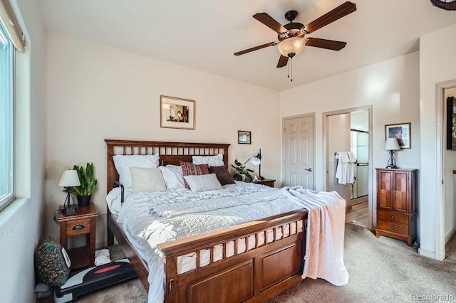 bedroom featuring ceiling fan and carpet