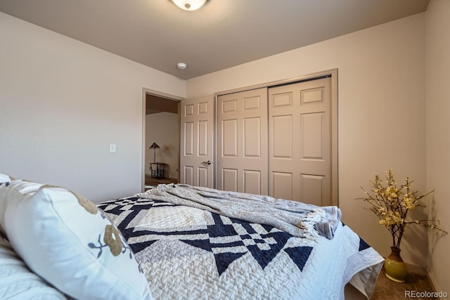 bedroom with carpet and a closet