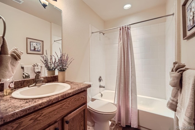 full bathroom with vanity, toilet, and shower / bath combo with shower curtain