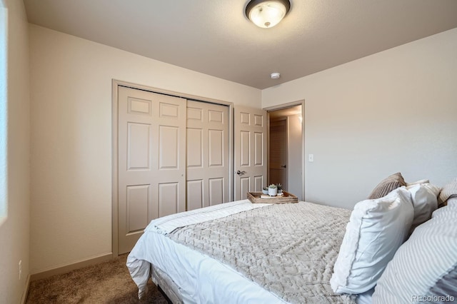 carpeted bedroom featuring a closet