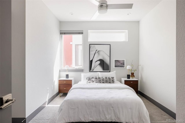 bedroom featuring ceiling fan and light carpet