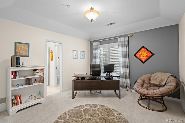 office space featuring baseboards, visible vents, and carpet flooring