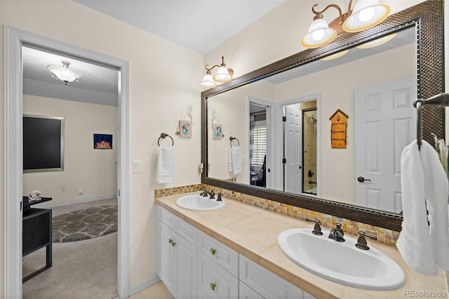 full bathroom featuring double vanity, an enclosed shower, and a sink