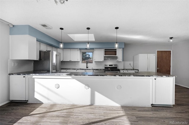 kitchen with pendant lighting, white cabinets, and stainless steel appliances