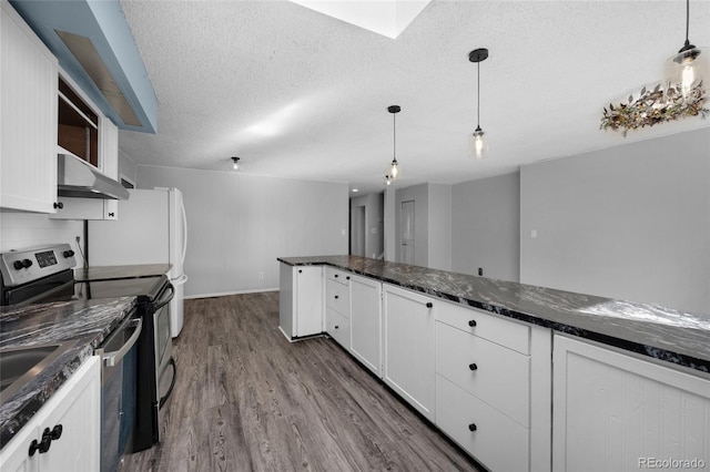 kitchen featuring pendant lighting, a textured ceiling, dark hardwood / wood-style flooring, white cabinetry, and stainless steel appliances