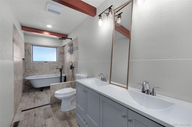 bathroom featuring beamed ceiling, vanity, and toilet