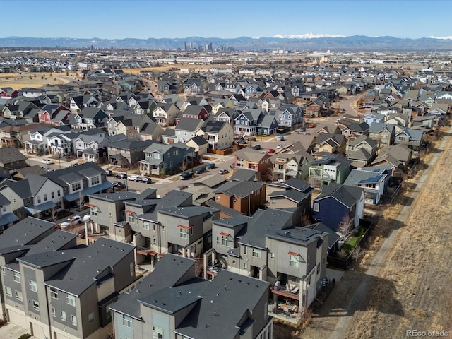 birds eye view of property featuring a mountain view and a residential view