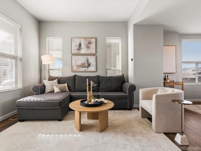 living room featuring baseboards and light wood finished floors