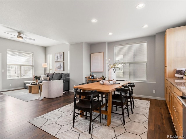 dining area featuring recessed lighting, baseboards, and wood finished floors