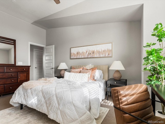 bedroom featuring lofted ceiling and carpet flooring