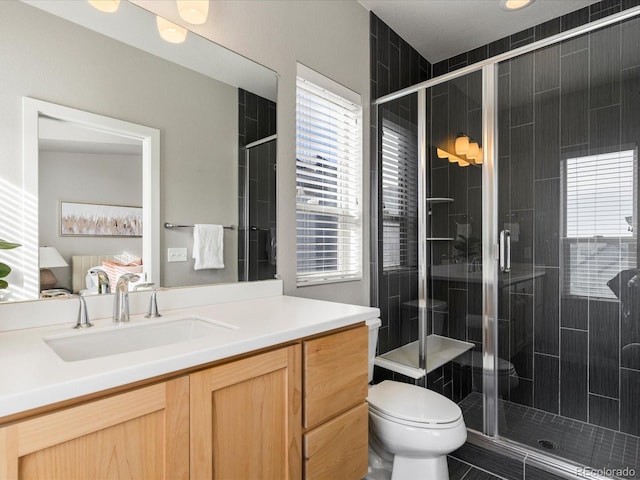 bathroom featuring vanity, ensuite bath, and a shower stall