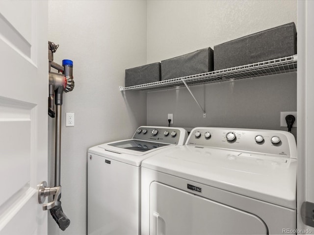 washroom with laundry area and washer and clothes dryer