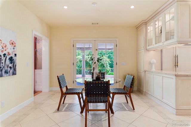 dining space featuring light tile patterned floors, baseboards, french doors, and recessed lighting