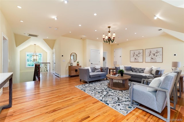 living area featuring a baseboard radiator, recessed lighting, visible vents, an inviting chandelier, and light wood-type flooring