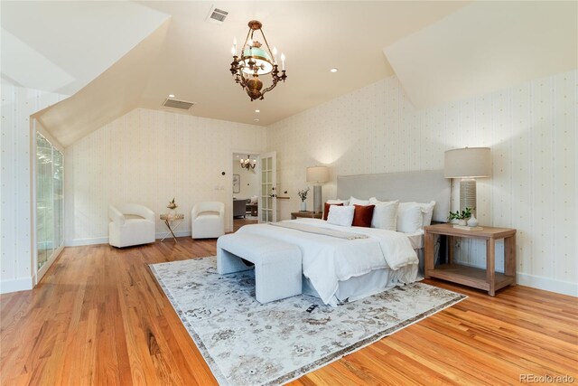 bedroom featuring visible vents, a notable chandelier, baseboards, and wallpapered walls