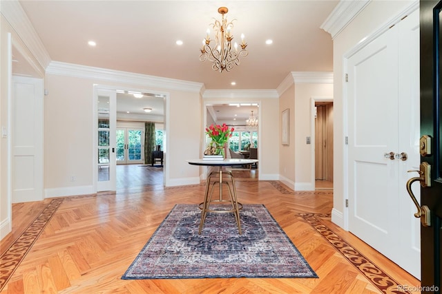 foyer featuring baseboards, a chandelier, crown molding, and recessed lighting