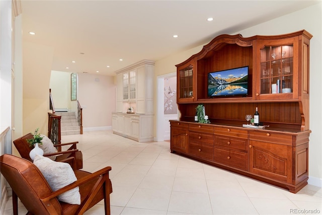 interior space featuring stairs, light tile patterned flooring, baseboards, and recessed lighting