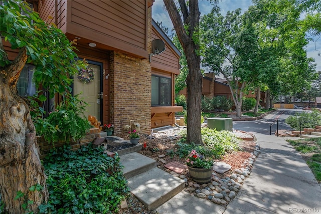 2685 S Dayton Way Unit 253, Denver, CO 80231 - doorway to property with brick siding
