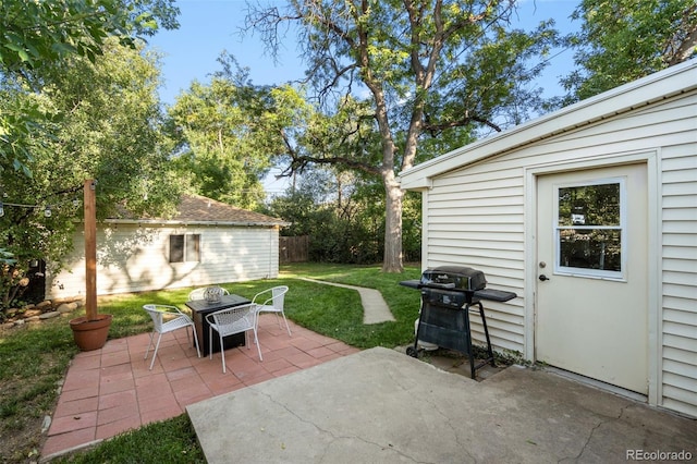 60 Vrain St, Denver, CO 80219 - view of patio with a grill and an outbuilding