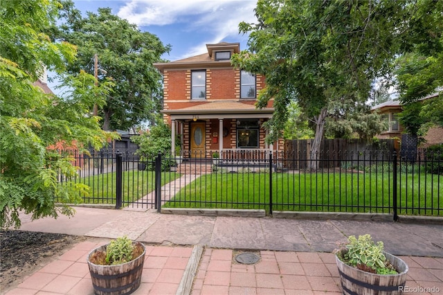 256 Bannock St, Denver, CO 80223 - traditional style home featuring a porch, a fenced front yard, a gate, and brick siding