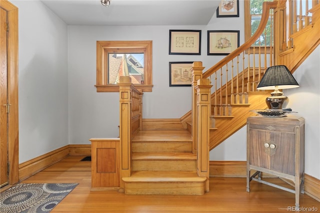256 Bannock St, Denver, CO 80223 - staircase with healthy amount of natural light and wood finished floors