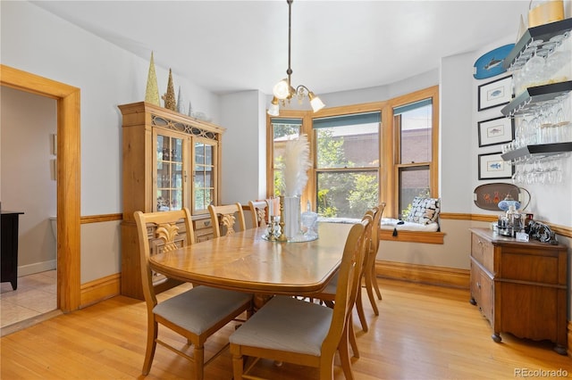 256 Bannock St, Denver, CO 80223 - dining space with light wood finished floors and a chandelier