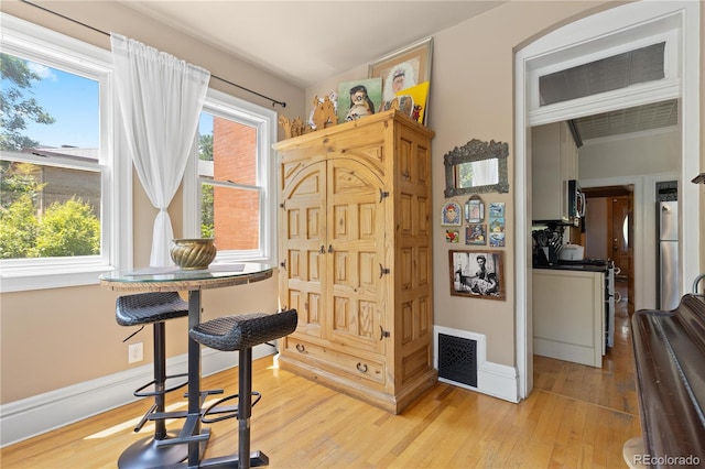 256 Bannock St, Denver, CO 80223 - dining room featuring healthy amount of natural light and light wood-style floors