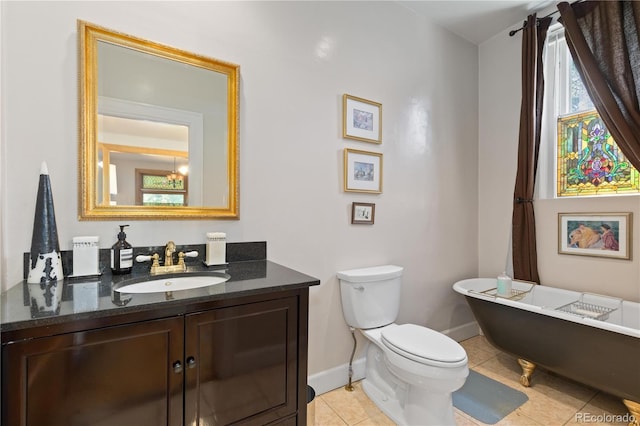 256 Bannock St, Denver, CO 80223 - full bathroom featuring a freestanding tub, vanity, and tile patterned floors