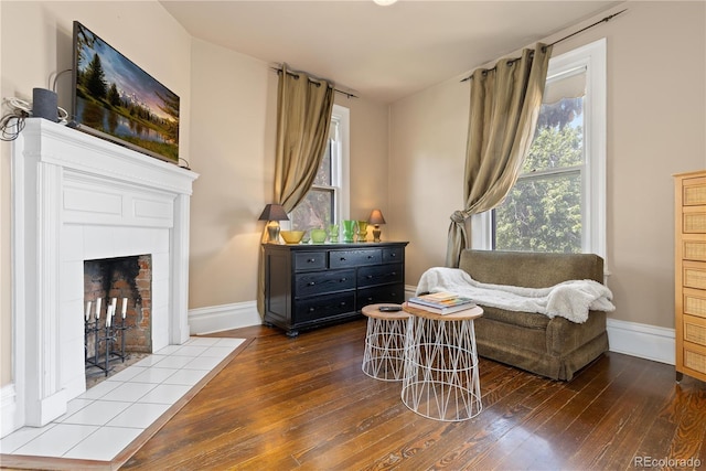 256 Bannock St, Denver, CO 80223 - sitting room featuring dark wood-style floors and a tile fireplace