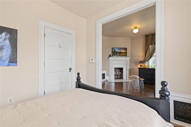 256 Bannock St, Denver, CO 80223 - bedroom featuring a fireplace with flush hearth
