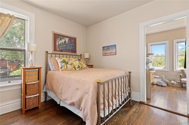 256 Bannock St, Denver, CO 80223 - bedroom with hardwood / wood-style floors and multiple windows
