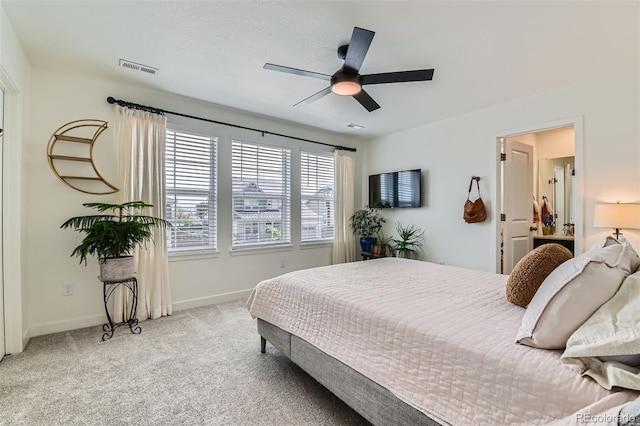 14551 Hudson St, Thornton, CO 80602 - bedroom featuring baseboards, light carpet, and a ceiling fan