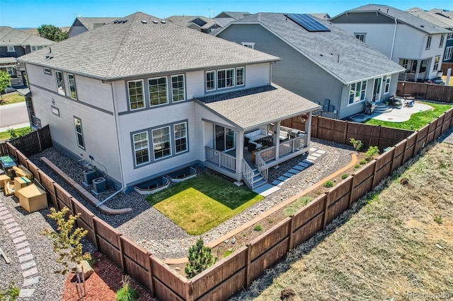 14551 Hudson St, Thornton, CO 80602 - rear view of house featuring roof with shingles, a patio area, a residential view, and central AC