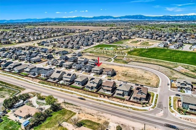 14551 Hudson St, Thornton, CO 80602 - aerial perspective of suburban area with a mountain backdrop
