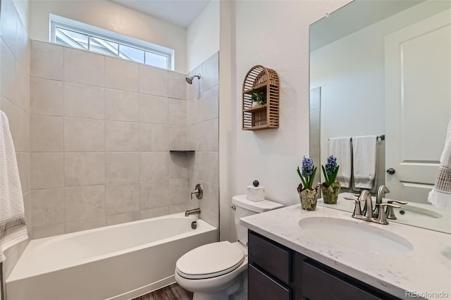 14551 Hudson St, Thornton, CO 80602 - full bathroom featuring vanity,  shower combination, and wood finished floors