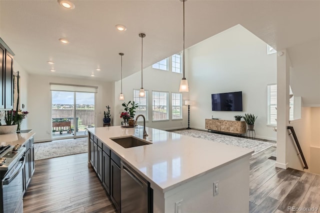 14551 Hudson St, Thornton, CO 80602 - kitchen featuring stainless steel appliances, open floor plan, dark wood-style flooring, recessed lighting, and decorative light fixtures