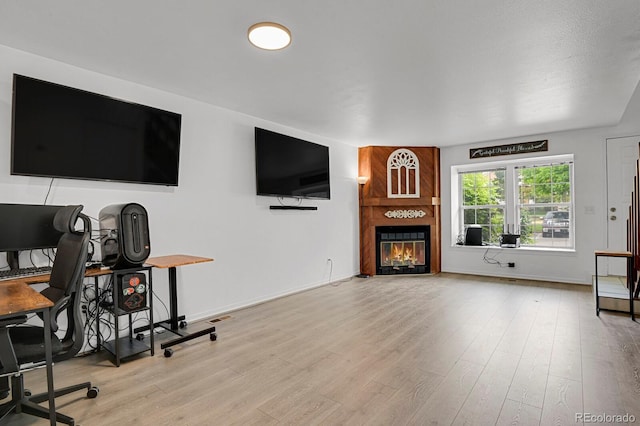 14396 E Temple Pl Unit D, Aurora, CO 80015 - living room with a fireplace, wood finished floors, and baseboards