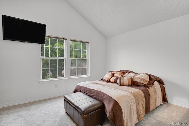 14396 E Temple Pl Unit D, Aurora, CO 80015 - bedroom featuring light carpet, baseboards, and vaulted ceiling